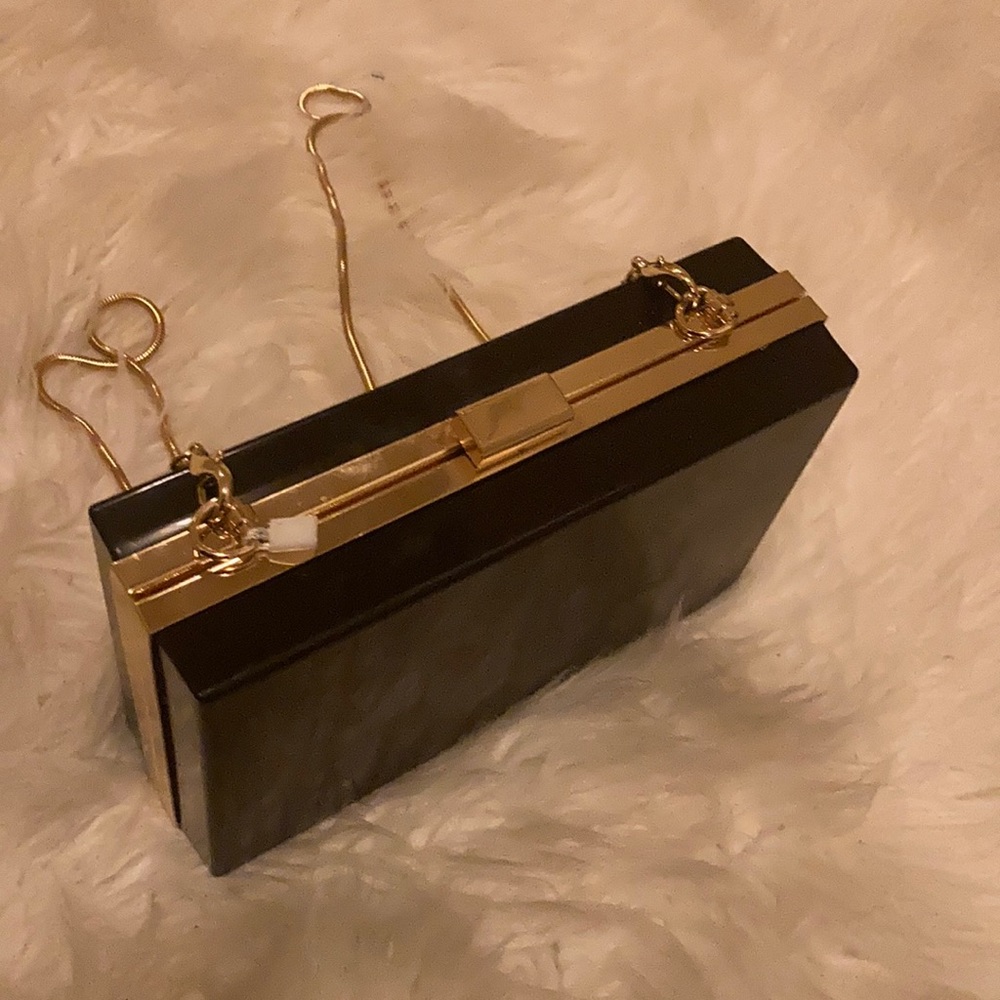 Women black and gold clutch purse